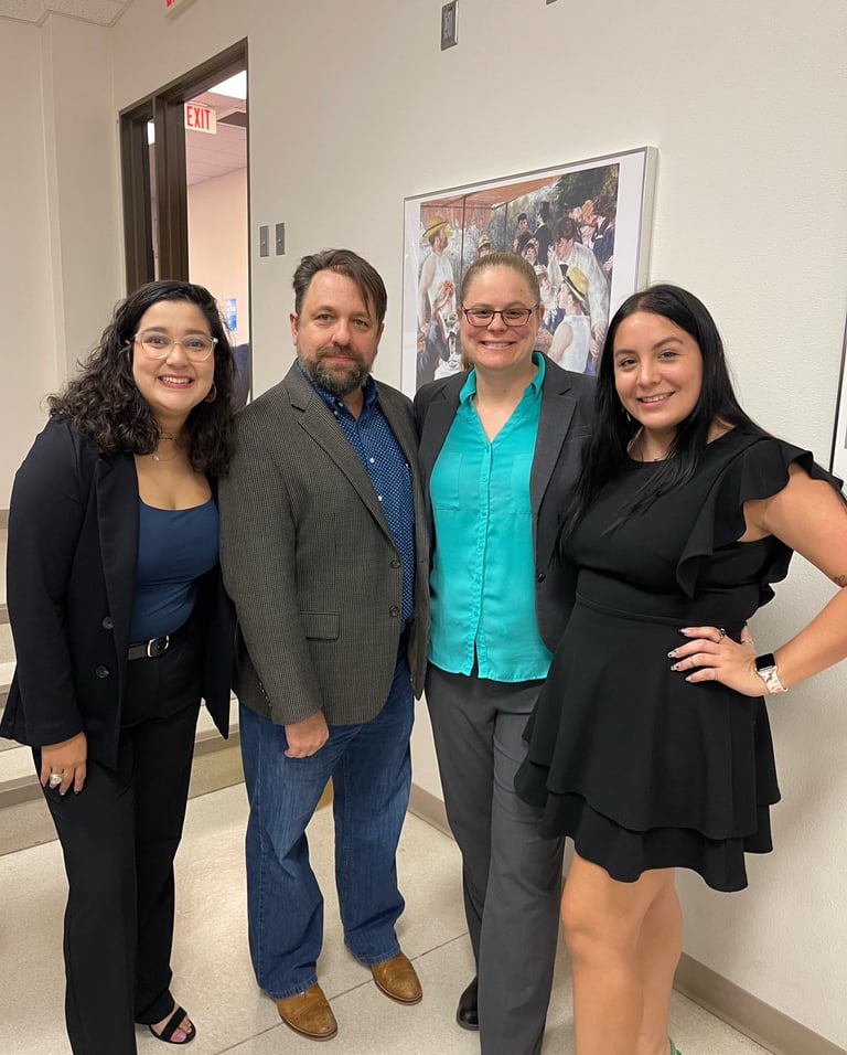 Dr. Hooton and Dr. Jason Pierce (center) with History Society leadership at their book launch event