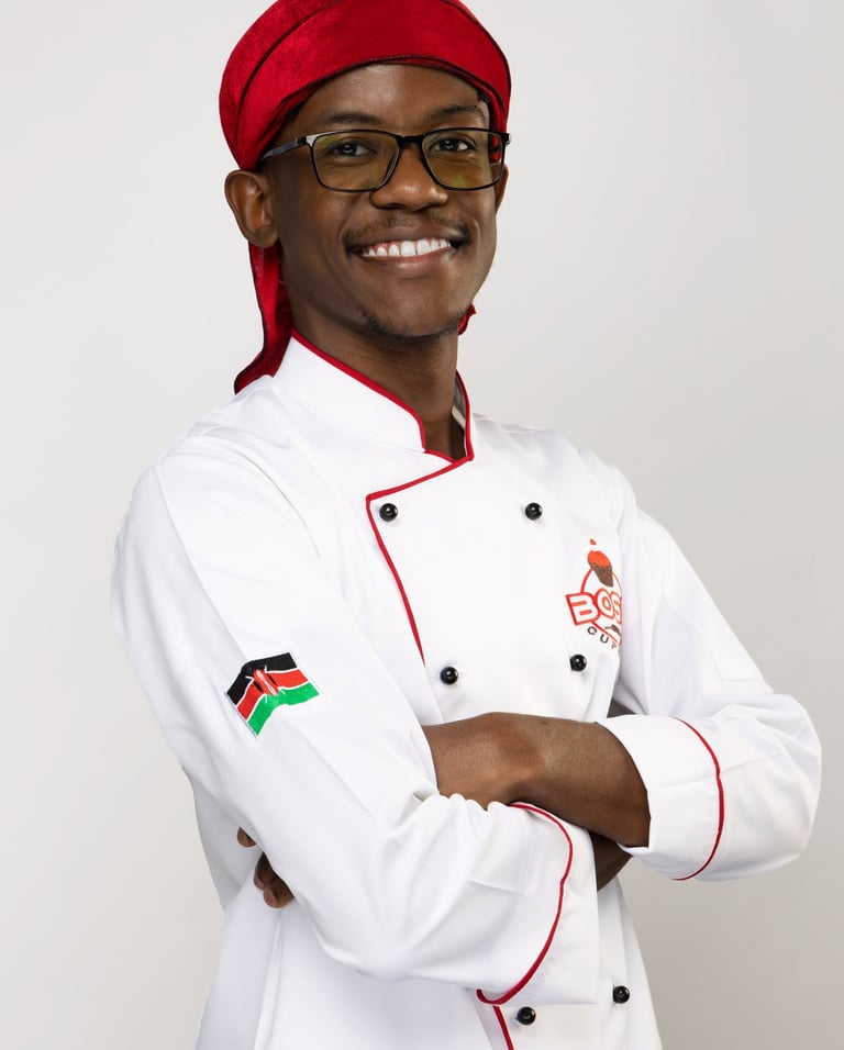 a man in a chef's uniform and a red hat
