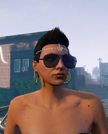 a man in a black top hat and sunglasses