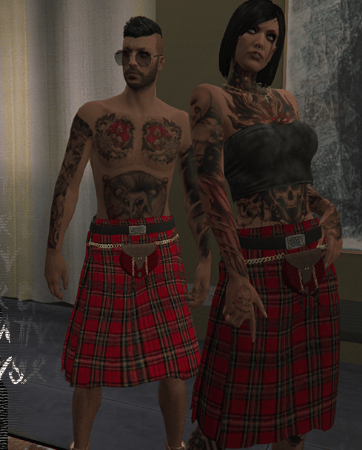 a man and woman in plaidered kilts