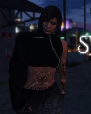 a woman in a black top and a black top with a tattoo on her chest