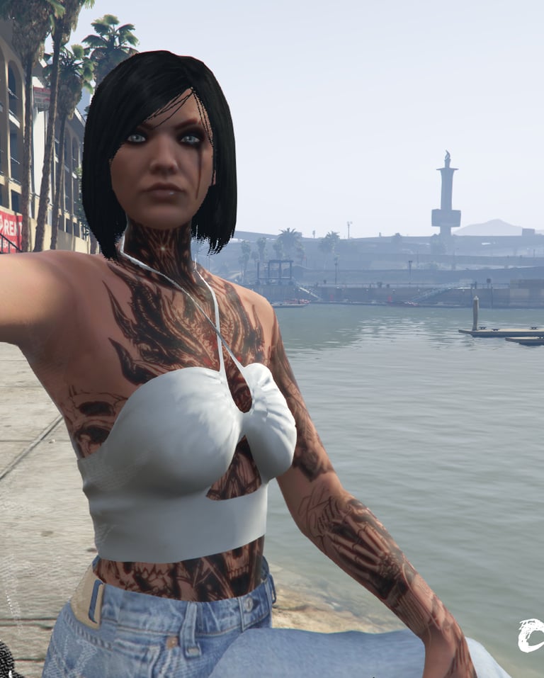 a woman with tattoos on her chest and chest