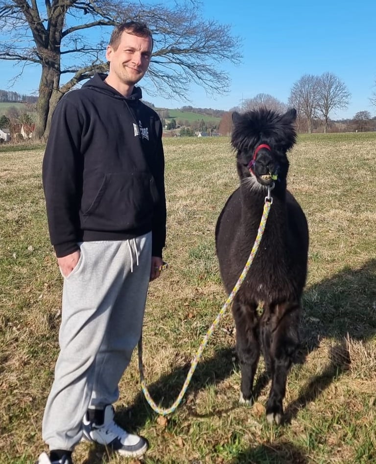 a picture of me with a alpaca