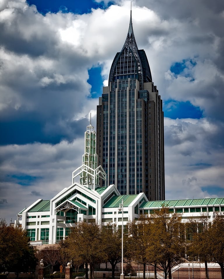 a large building with a clock tower in the background