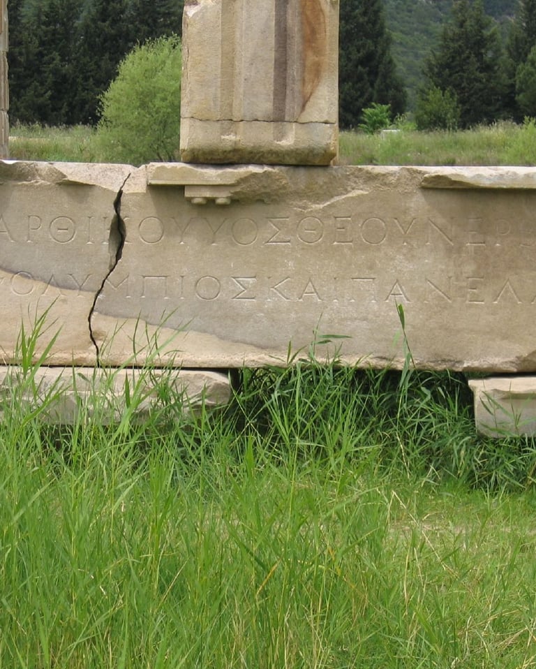 Remains of stone inscriptions found on a cracked marble slab in the ancient city of Erythrai.