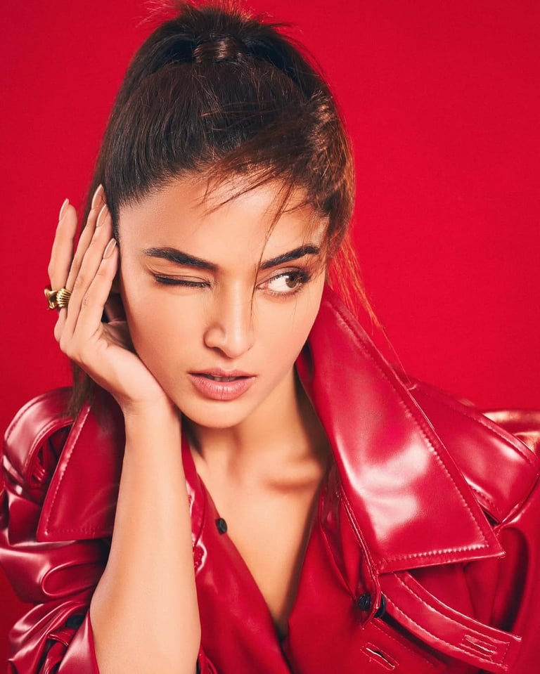 a woman in a red leather jacket