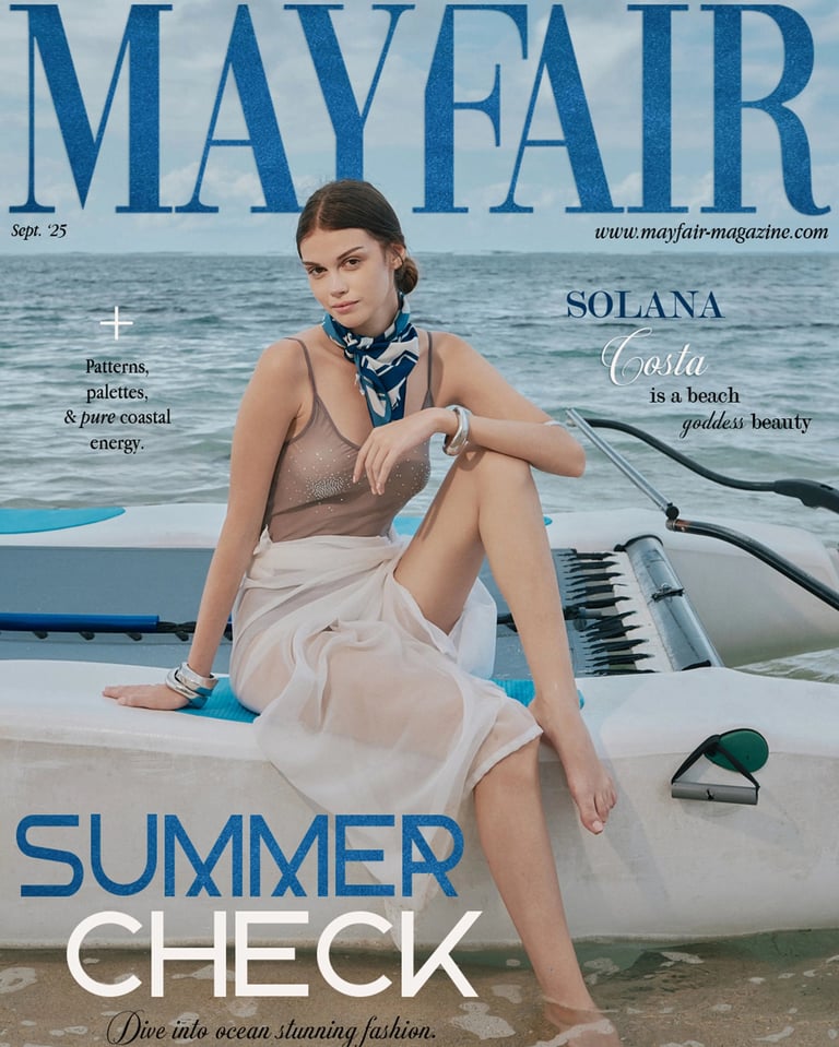 Mayfair Magazine September 2025 cover featuring a model in transparent swimwear seated on a mini catamaran.