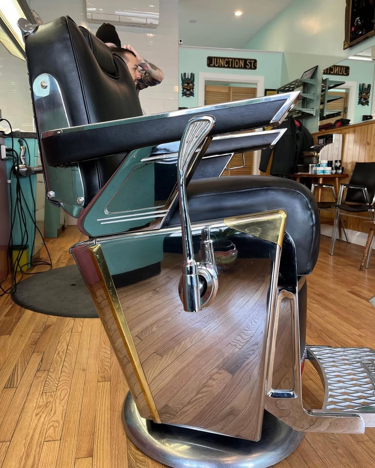 reupholstered vintage Takara Belmont barber chair side view