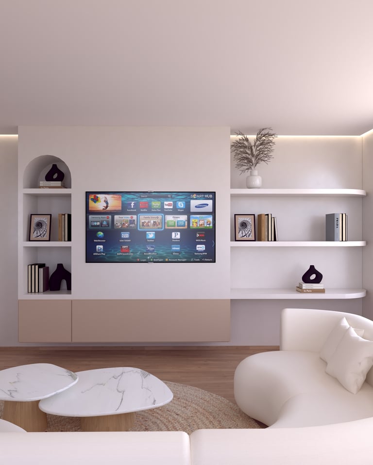Modern living room with a smart TV mounted on a minimalist white wall with built-in shelves and a curved sofa.