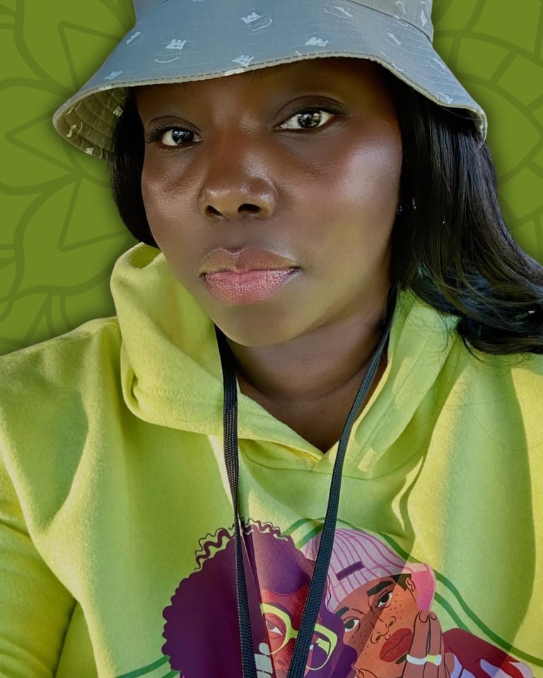 Black woman wearing a grey bucket hat and lime green graphic hoodie against a green leaf background.