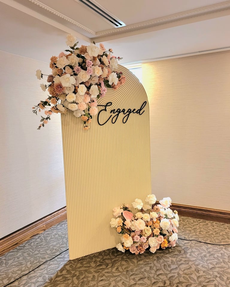 engagement party backdrop with a beige backdrop 