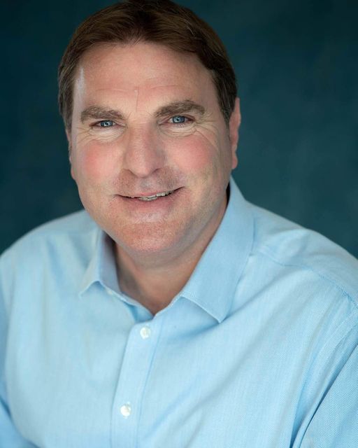 a man in a blue shirt and a blue shirt