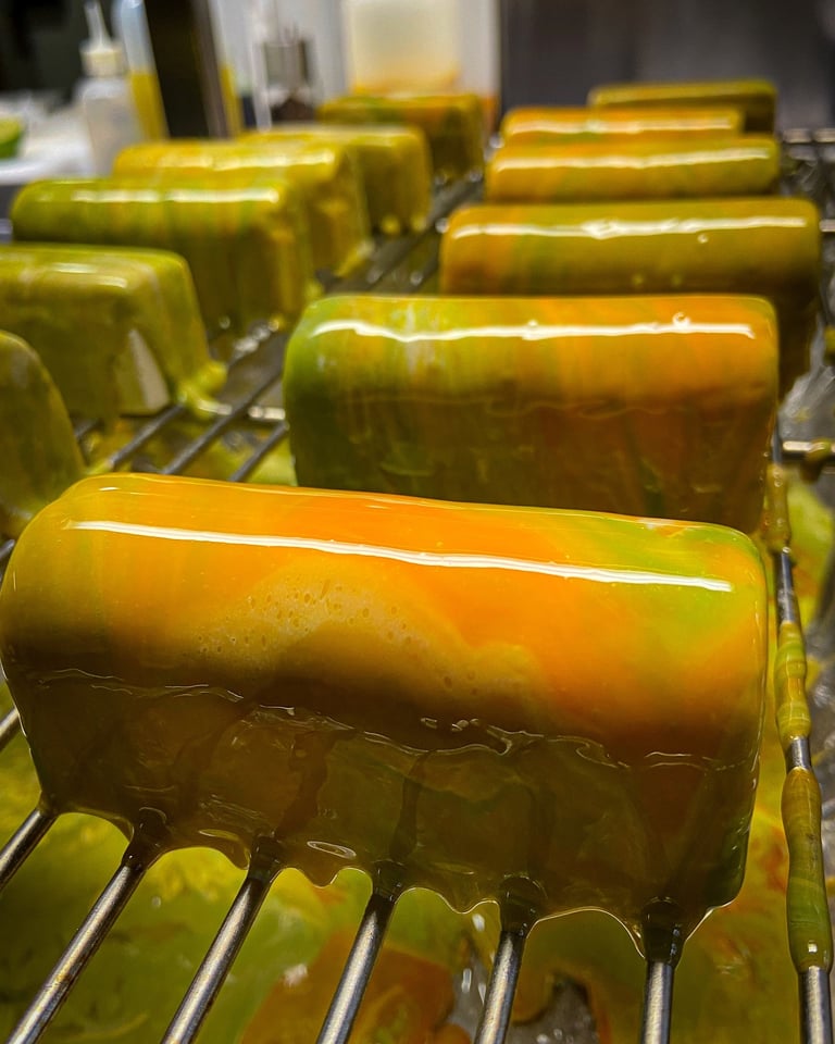 Multicolor glazed entremet with green and orange colours