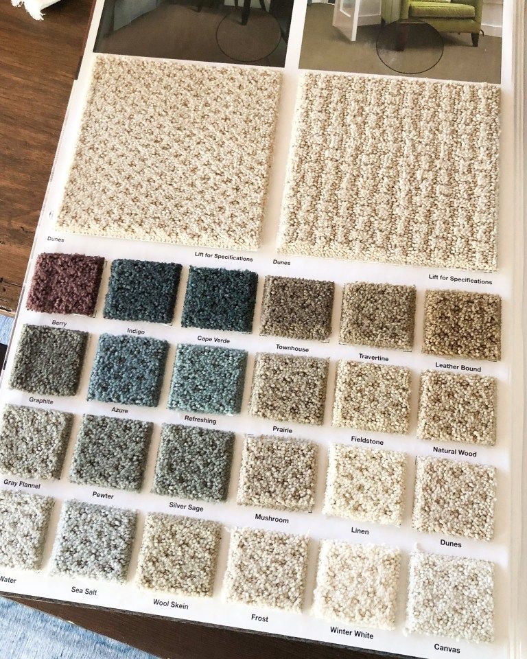 a book opened to show a selection of carpeting