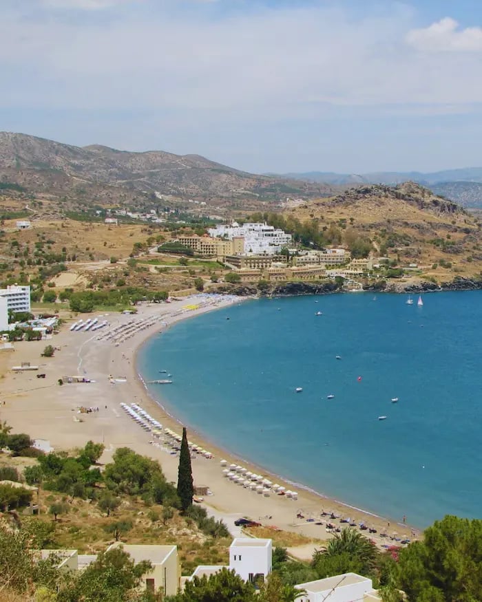 a beach with a view of a beach and a boat