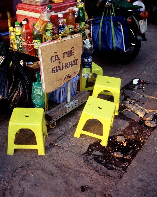 Plastic chairs in Saigon on a pavement coffee stall