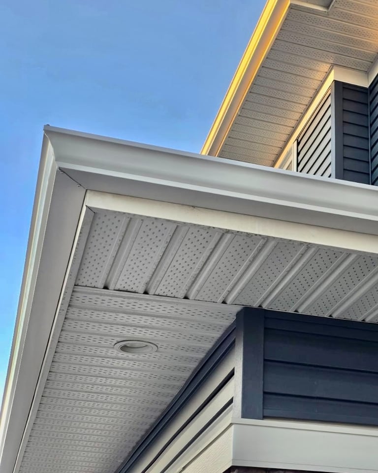 New white gutters and downspouts installation