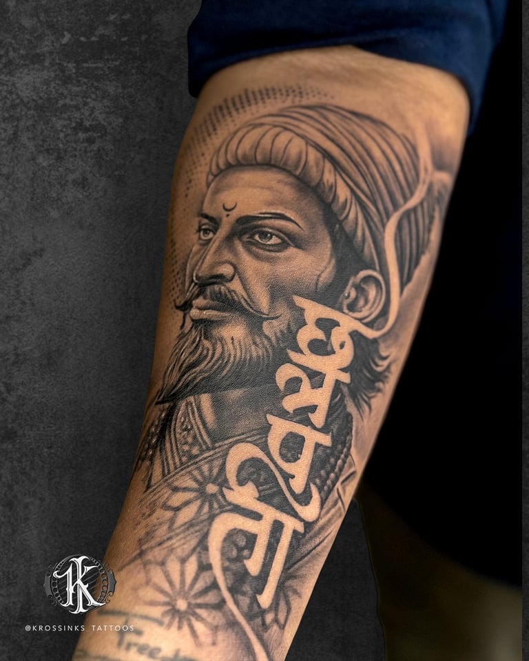Realistic portrait tattoo with Devanagari script on forearm by professional tattoo artist in Navi Mu