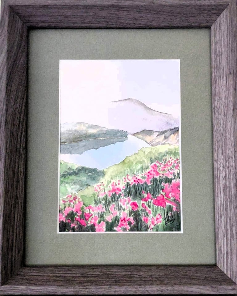 a picture of a painting of a mountain and flowers