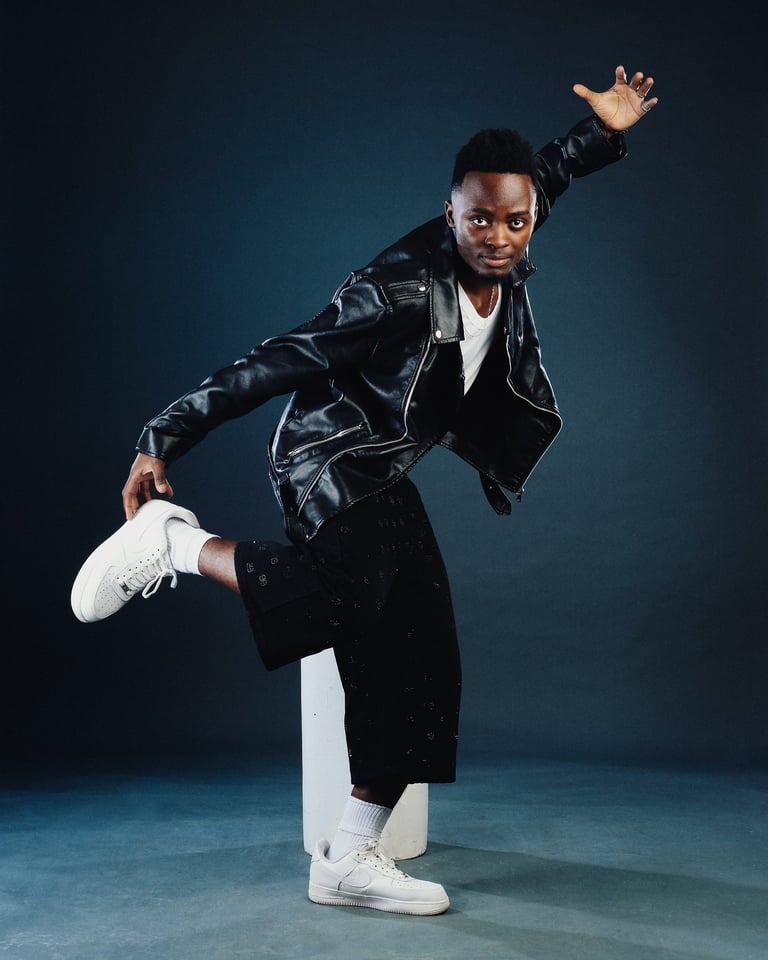Amapiano teacher Henry of TheOne Studios in Nairobi, wearing black bomber jacket