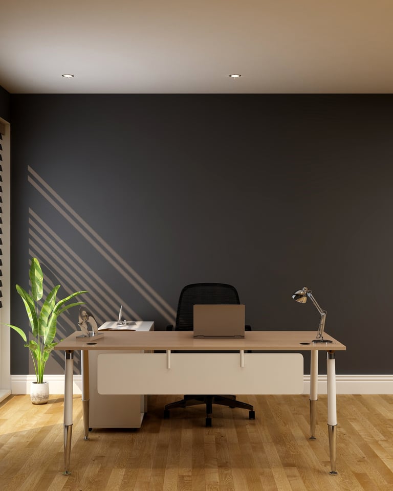 Modern home office with a minimalist wooden desk, ergonomic chair, and laptop against a dark grey wall.