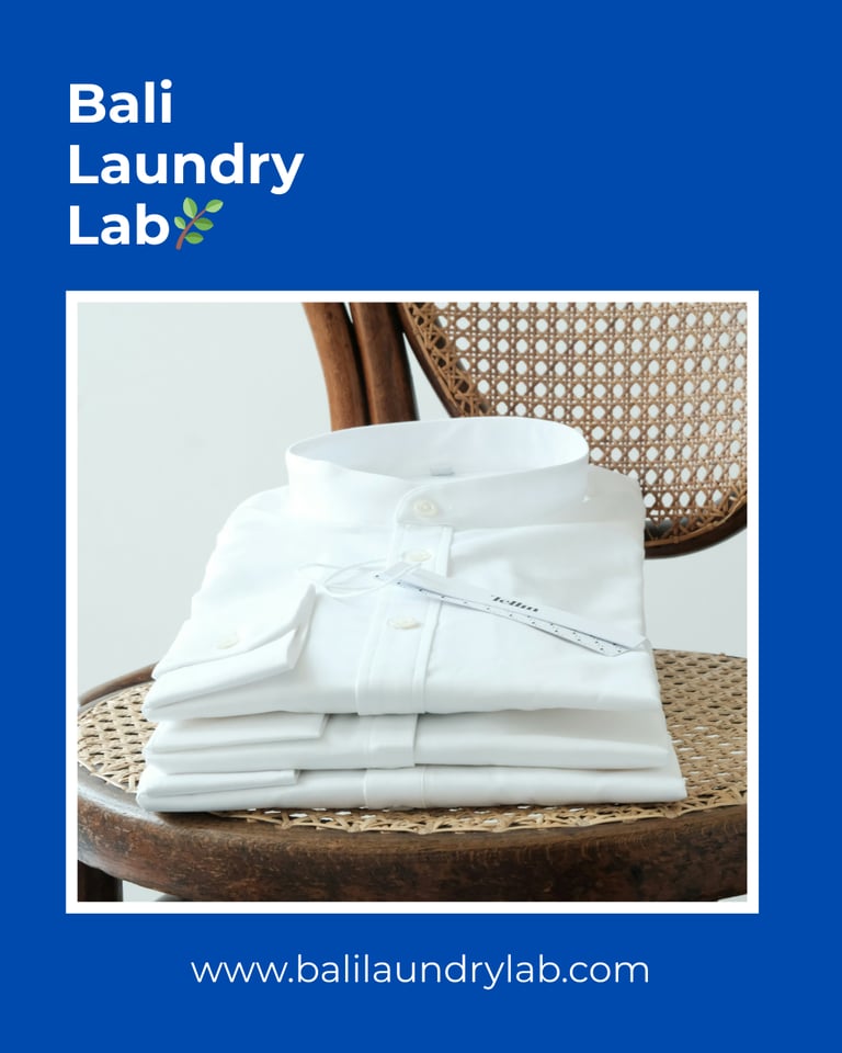 Freshly folded laundry on a wooden chair — clean and eco drop‑off laundry in Renon, Denpasar.
