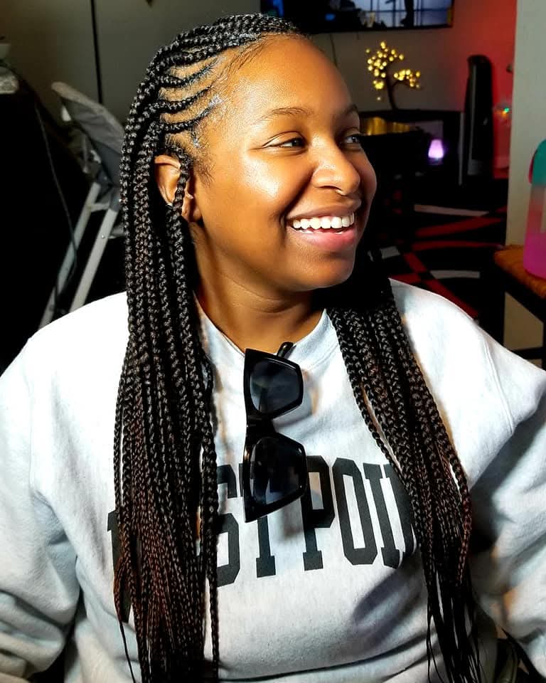 A woman with box braids hairstyle