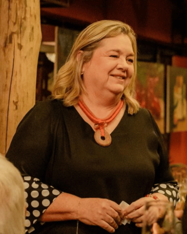 a woman in a black top and a man in a red shirt
