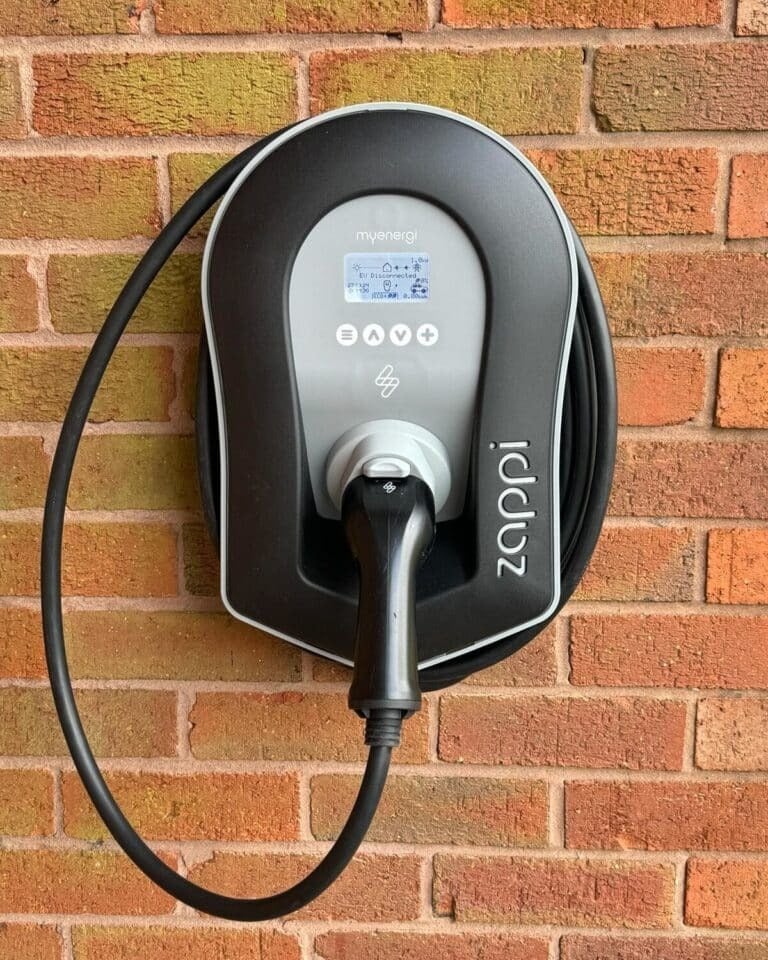 Wall-mounted EV charger installed on driveway in Dartford by Alma Electrical