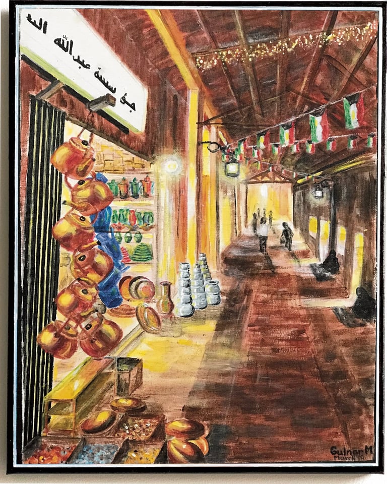 Interior of traditional Arabic souq with kitchenware shop in foreground 