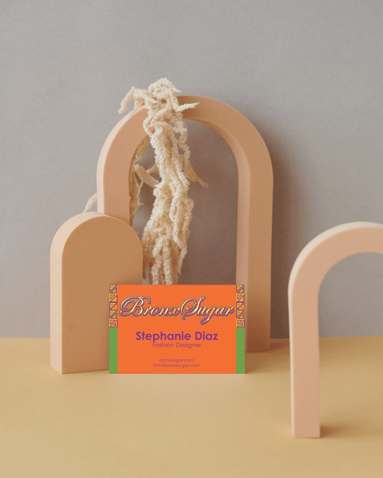 Bronx Sugar fashion designer business card displayed on aesthetic arch props.