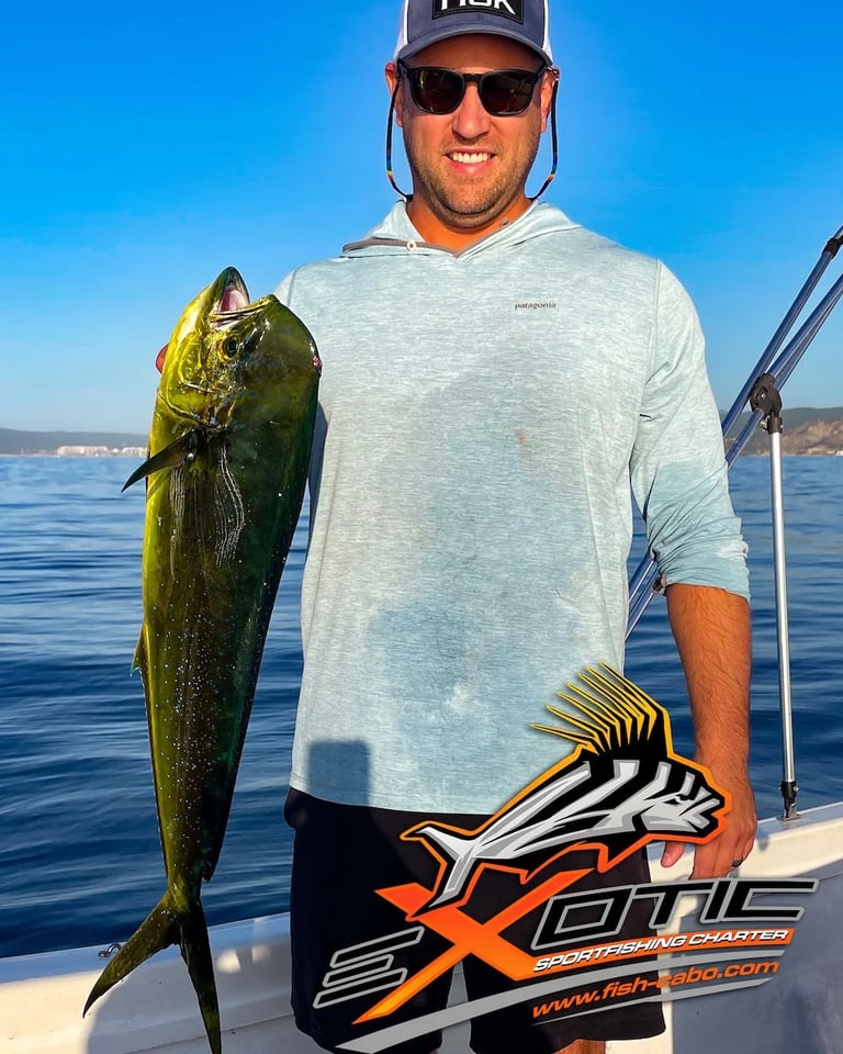 a man holding a fish fish on a boat