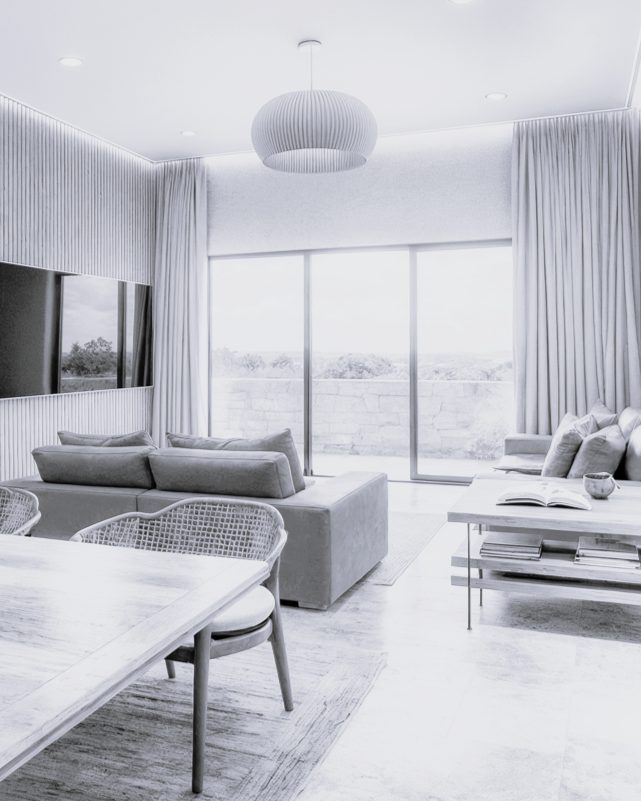 Sala de estar de proyecto residencial diseñado por CHB Arquitectura en La Paz, BCS, con acabados con