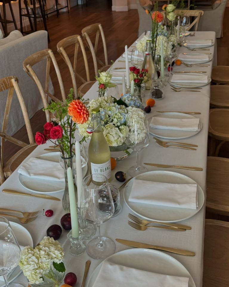 a table with a long table set for a dinner