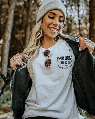 a woman wearing a white t - shirt and a black jacket