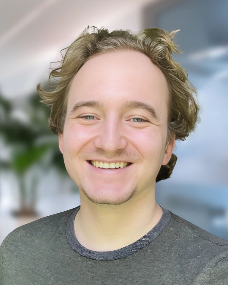 a man with a beard and a beard smiling