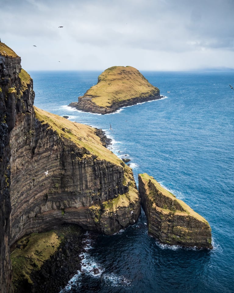 Basalt sea stacks and sheer cliff face near Skopun, textured rock and wild Atlantic scenery, Faroe Islands seascape