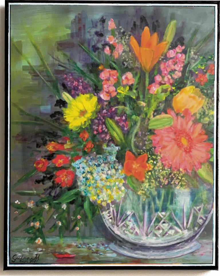 A crystal vase with colorful flowers