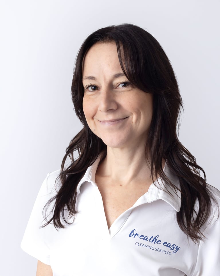 a cleaning professional smiling