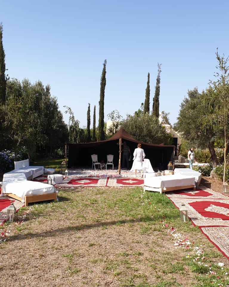 a wedding ceremony with a red carpet and a red carpet