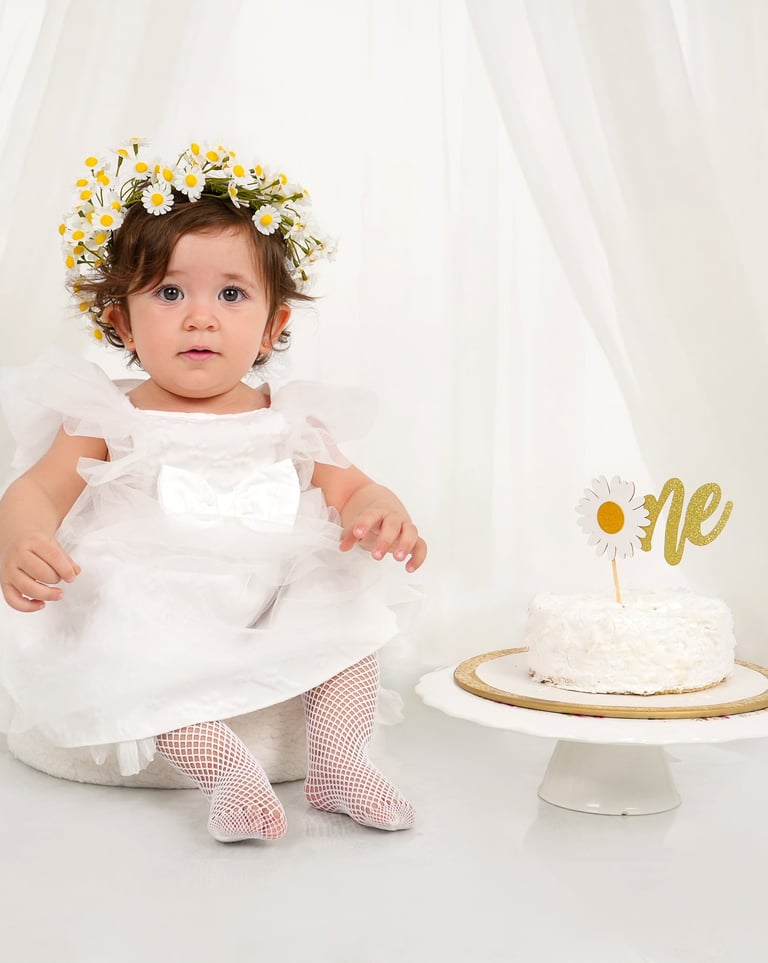 Smiling little one during a cake smash session.