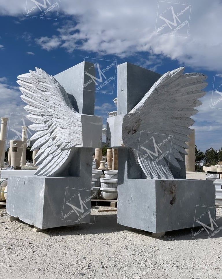 a statue of a winged cross with wings