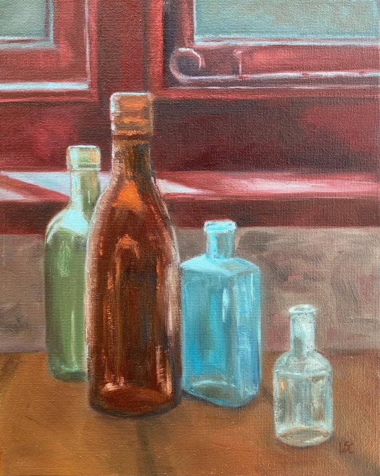 An original oil painting of four coloured glass bottles on a window ledge