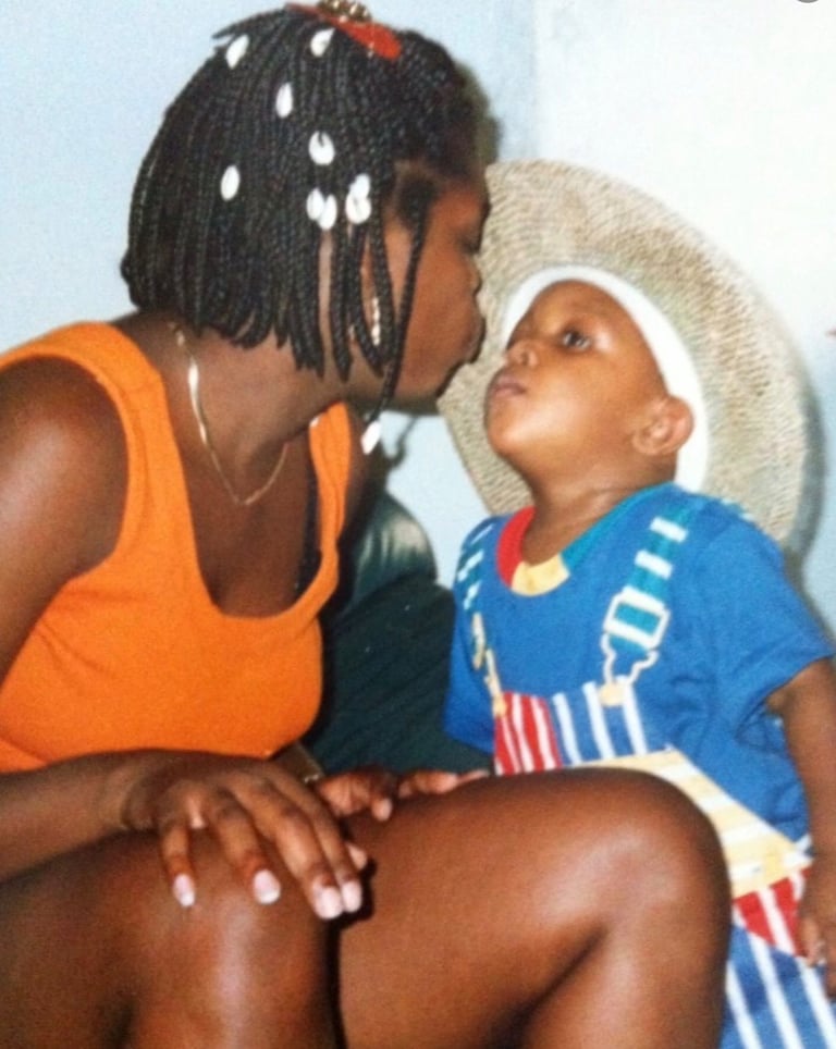 Black Mother kissing her son 