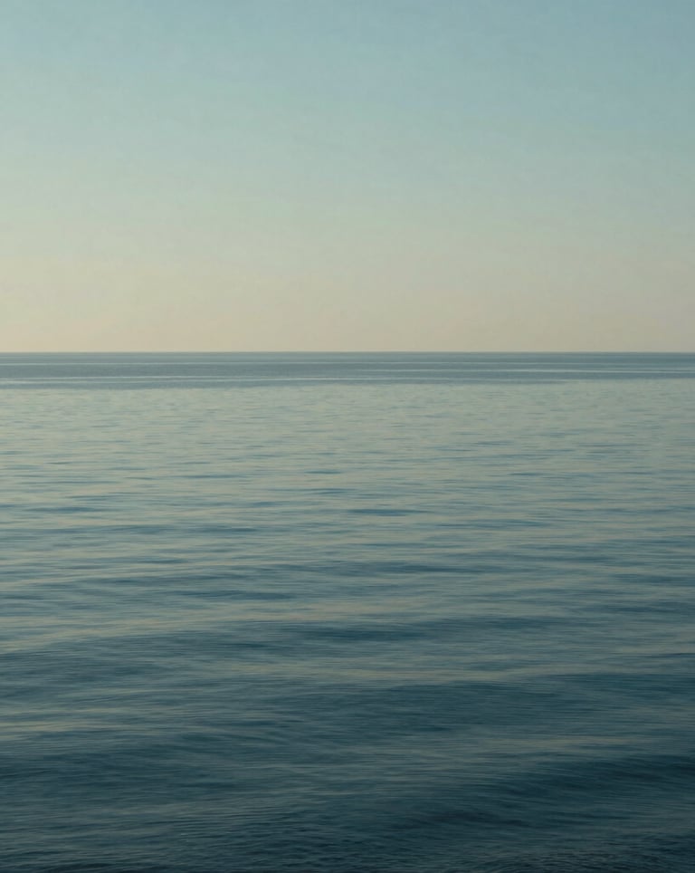 Cinematic photography of the horizon over a calm sea from a high vantage point, with elegant soft blue and sage tones reflecting the brand's palette.