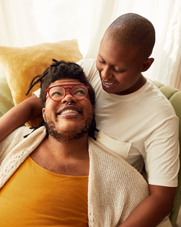 a man and woman sitting on a couch