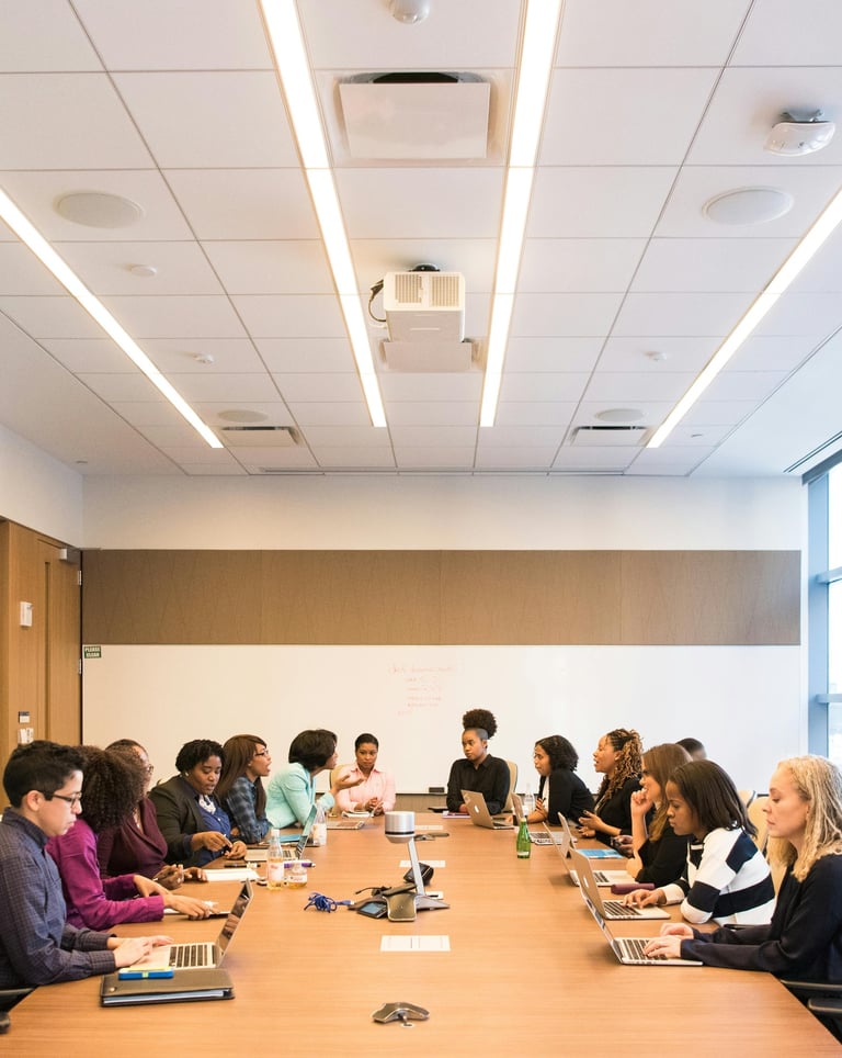 a group of people sitting around a table