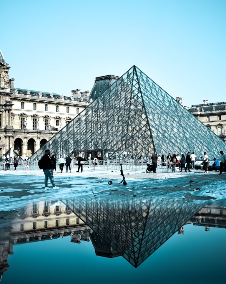 Paris France ,a large glass pyramid with a pyramid shaped structure