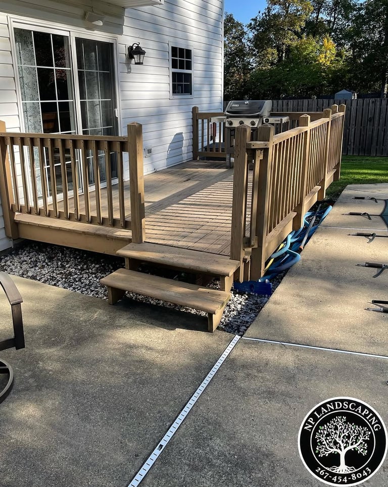 excellent landscaping and hardscaping of grass, stones and trees by NP Landscaping