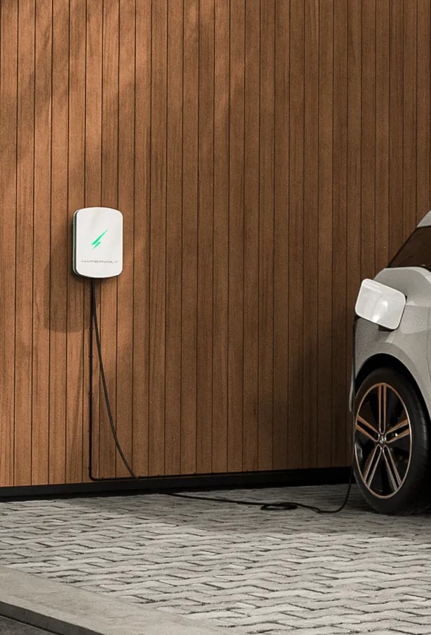 Wall-mounted EV charger installed on driveway in Orpington by Alma Electrical